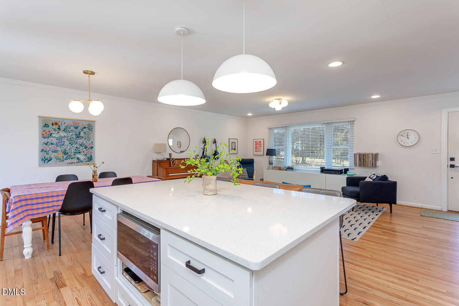 3200 Fairforest Place Raleigh, NC 27604 - Photo 9 of 40 a view of kitchen island with furniture and wooden floor