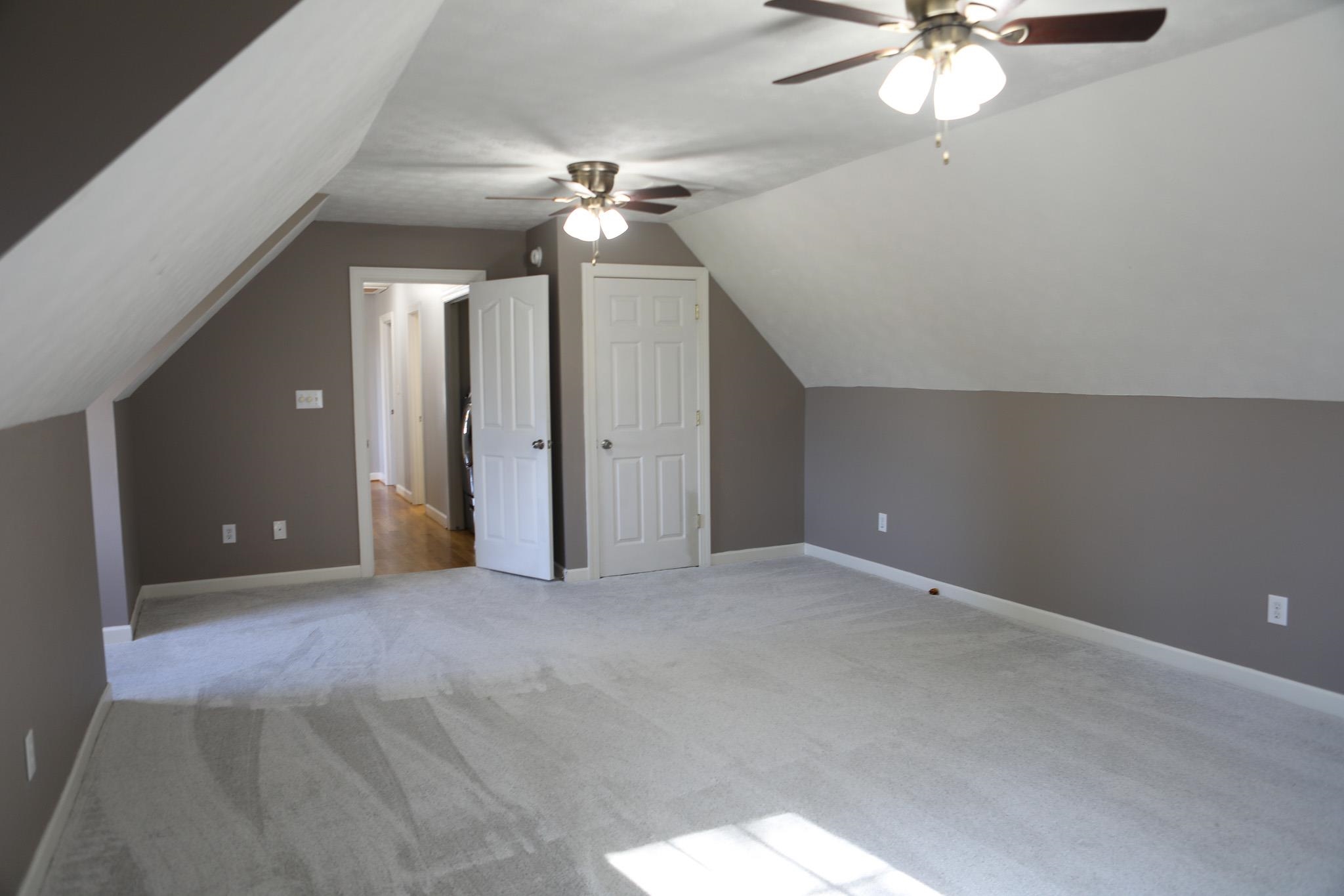 182 Henkel Road Waynesboro, VA 22980 - Photo 68 of 74 an empty room with a chandelier fan and a chandelier fan