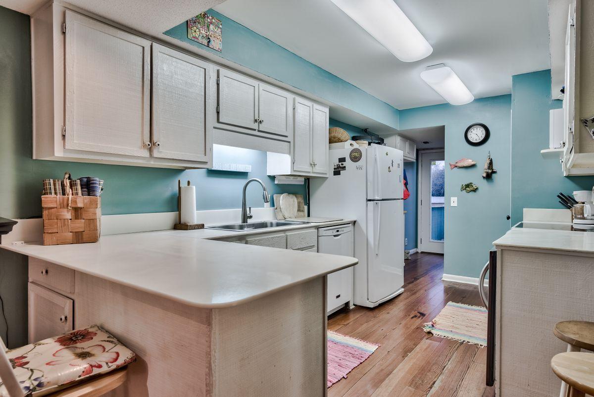 487 Blue Mountain Road Santa Rosa Beach, FL 32459 - Photo 23 of 32 a kitchen with stainless steel appliances a stove a refrigerator and a sink