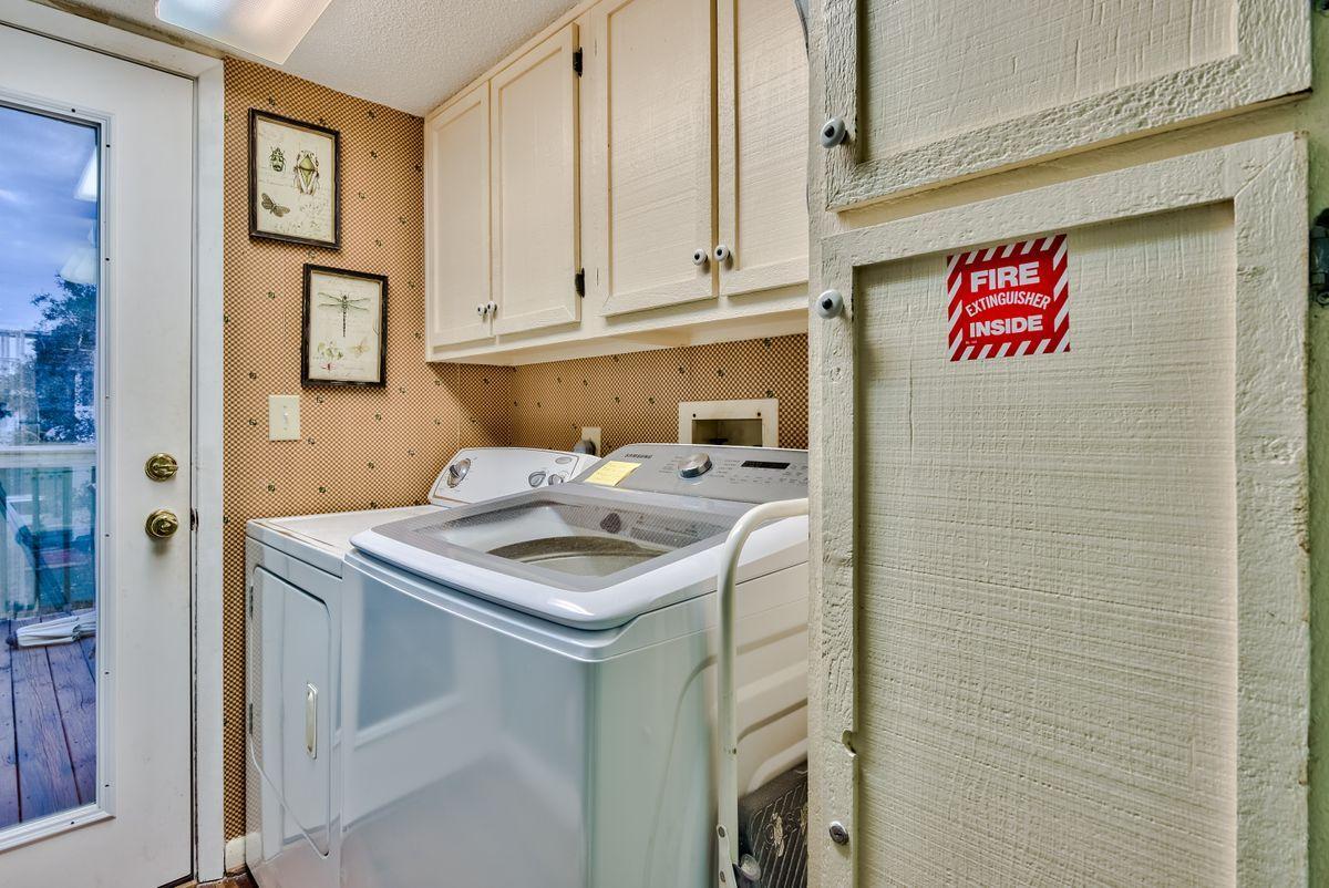 487 Blue Mountain Road Santa Rosa Beach, FL 32459 - Photo 25 of 32 a bathroom with a sink and a mirror