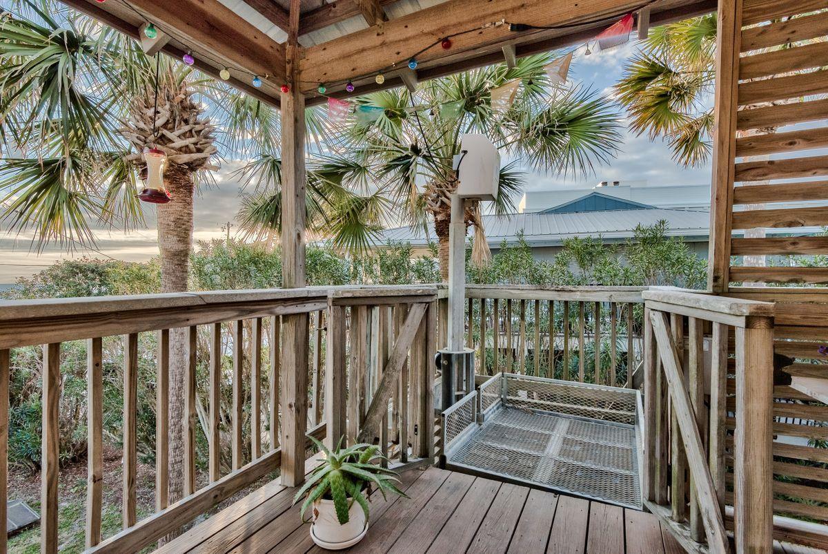 487 Blue Mountain Road Santa Rosa Beach, FL 32459 - Photo 30 of 32 a view of balcony with furniture and wooden floor
