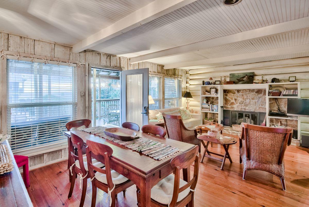 487 Blue Mountain Road Santa Rosa Beach, FL 32459 - Photo 3 of 32 a dining room with furniture and wooden floor