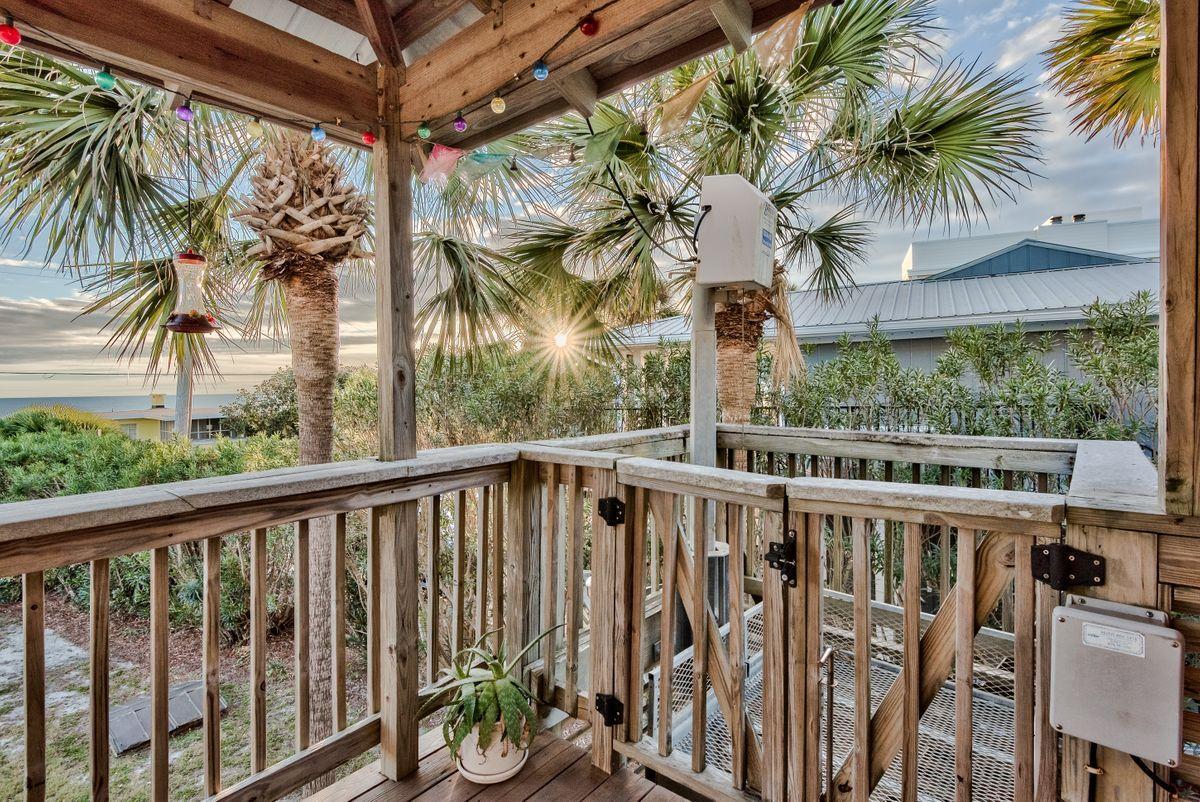 487 Blue Mountain Road Santa Rosa Beach, FL 32459 - Photo 31 of 32 a view of a balcony with potted plants