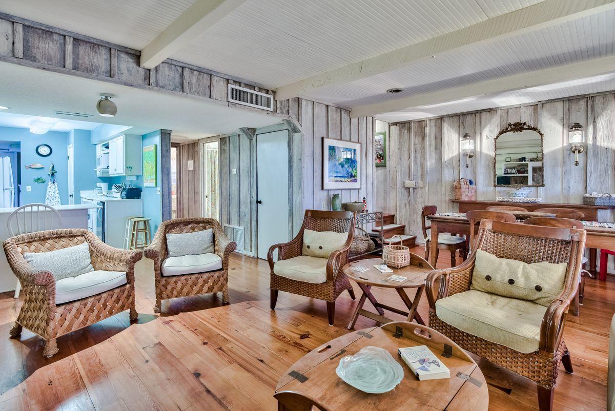 487 Blue Mountain Road Santa Rosa Beach, FL 32459 - Photo 7 of 32 a living room with furniture and a wooden floor