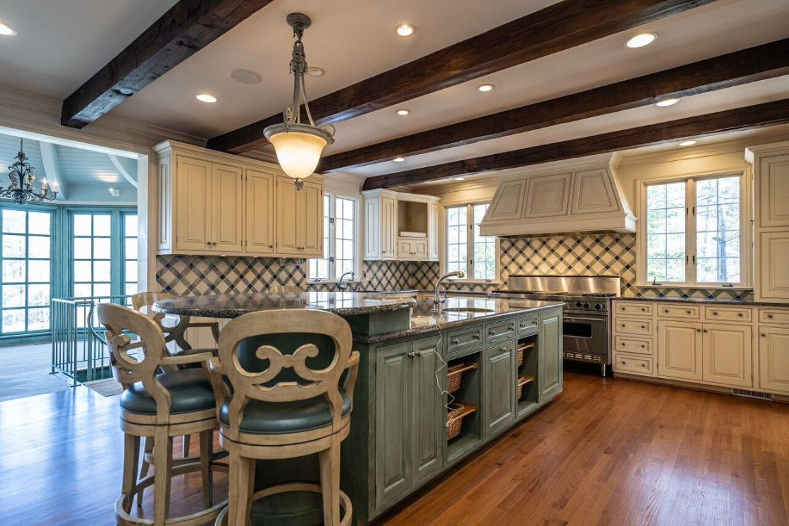 2805 Lakeview Drive Raleigh, NC 27608 - Photo 12 of 28 a kitchen with stainless steel appliances granite countertop a stove and a wooden floors
