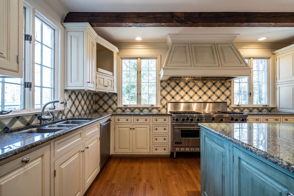 2805 Lakeview Drive Raleigh, NC 27608 - Photo 14 of 28 a kitchen with stainless steel appliances granite countertop a stove a sink and a microwave