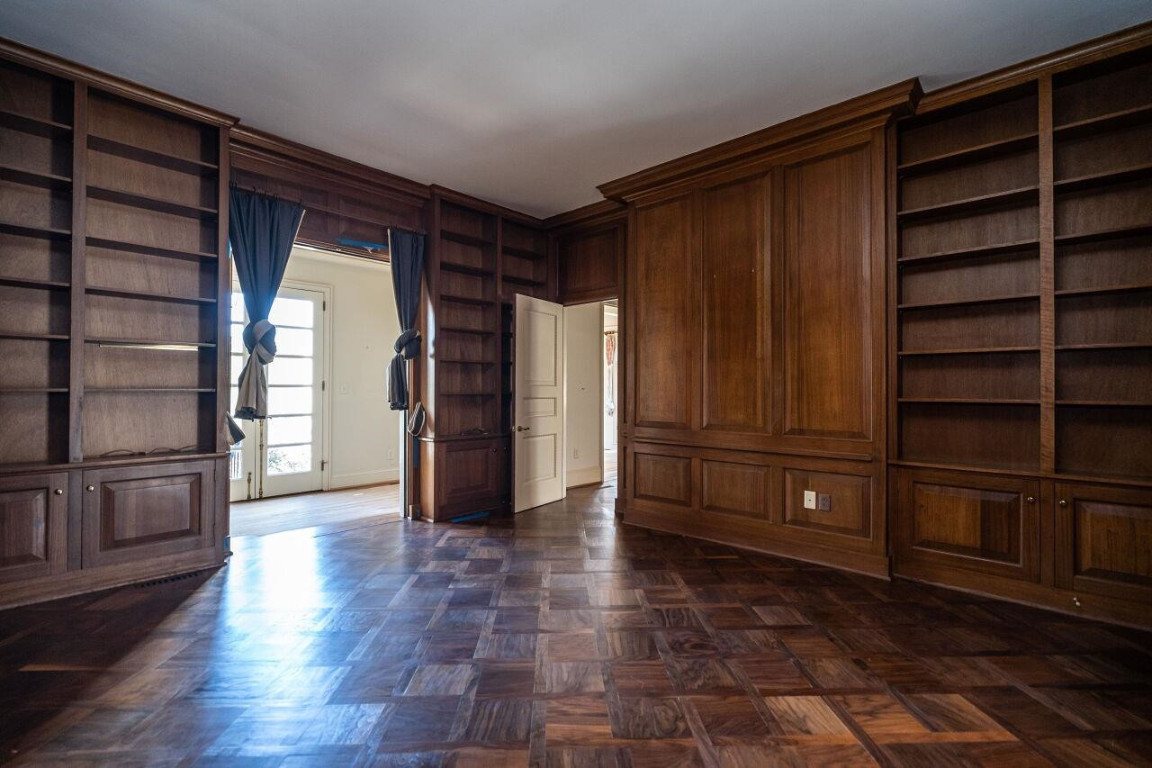 2805 Lakeview Drive Raleigh, NC 27608 - Photo 16 of 28 a view of empty room with wooden floor and cabinet