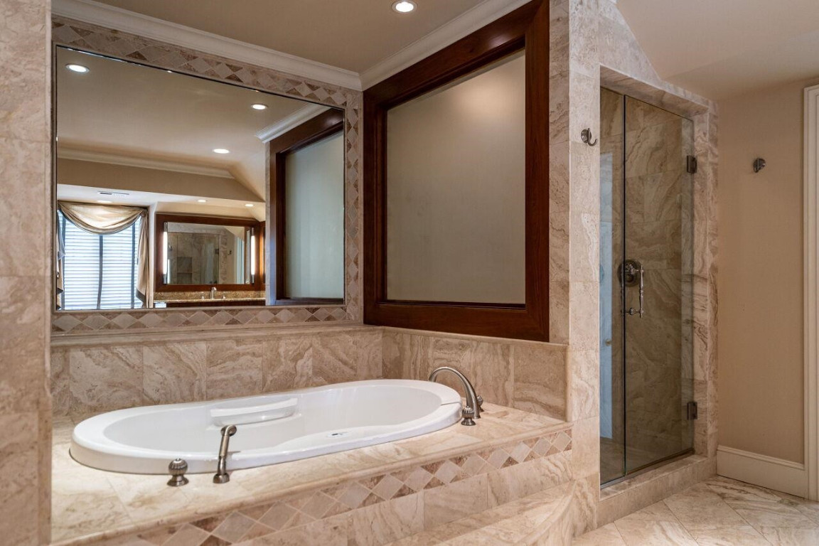 2805 Lakeview Drive Raleigh, NC 27608 - Photo 20 of 28 a bathroom with a tub a double vanity sink and mirror