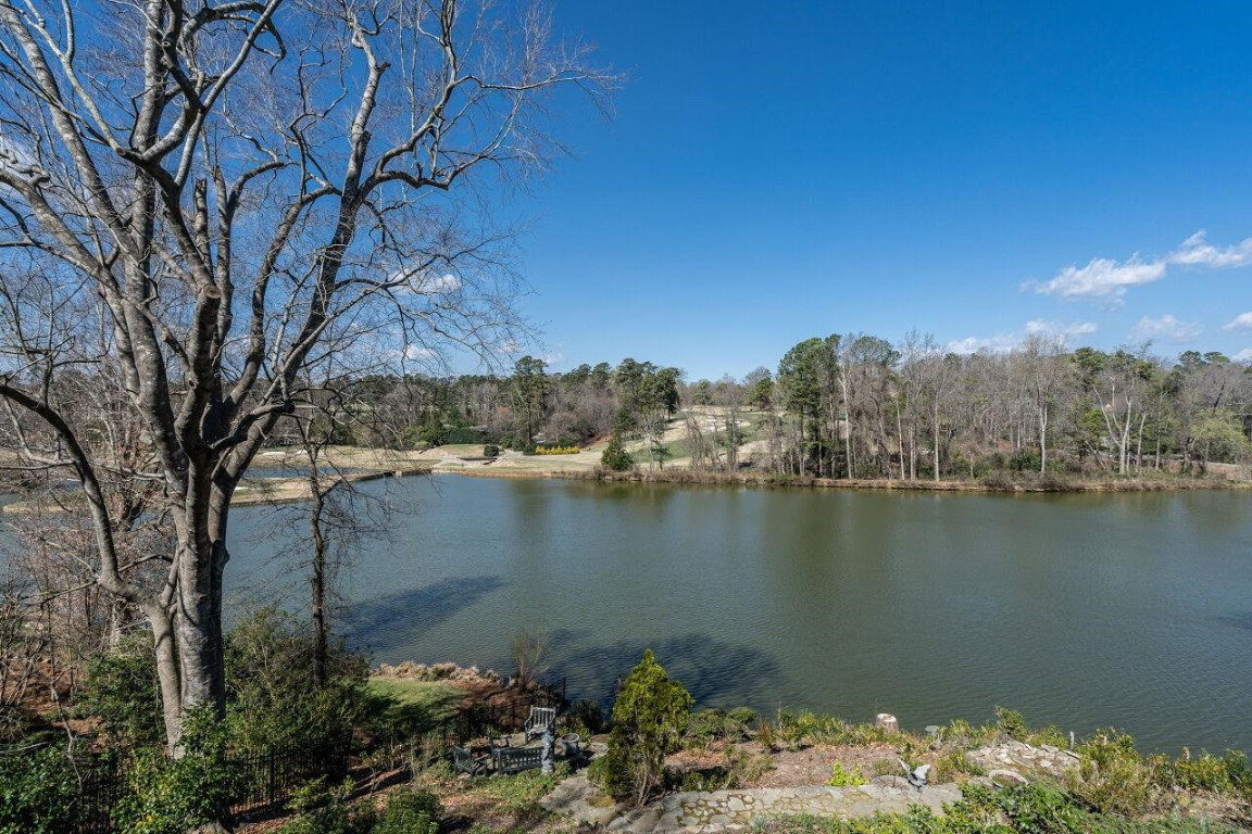 2805 Lakeview Drive Raleigh, NC 27608 - Photo 26 of 28 a view of a lake with a city