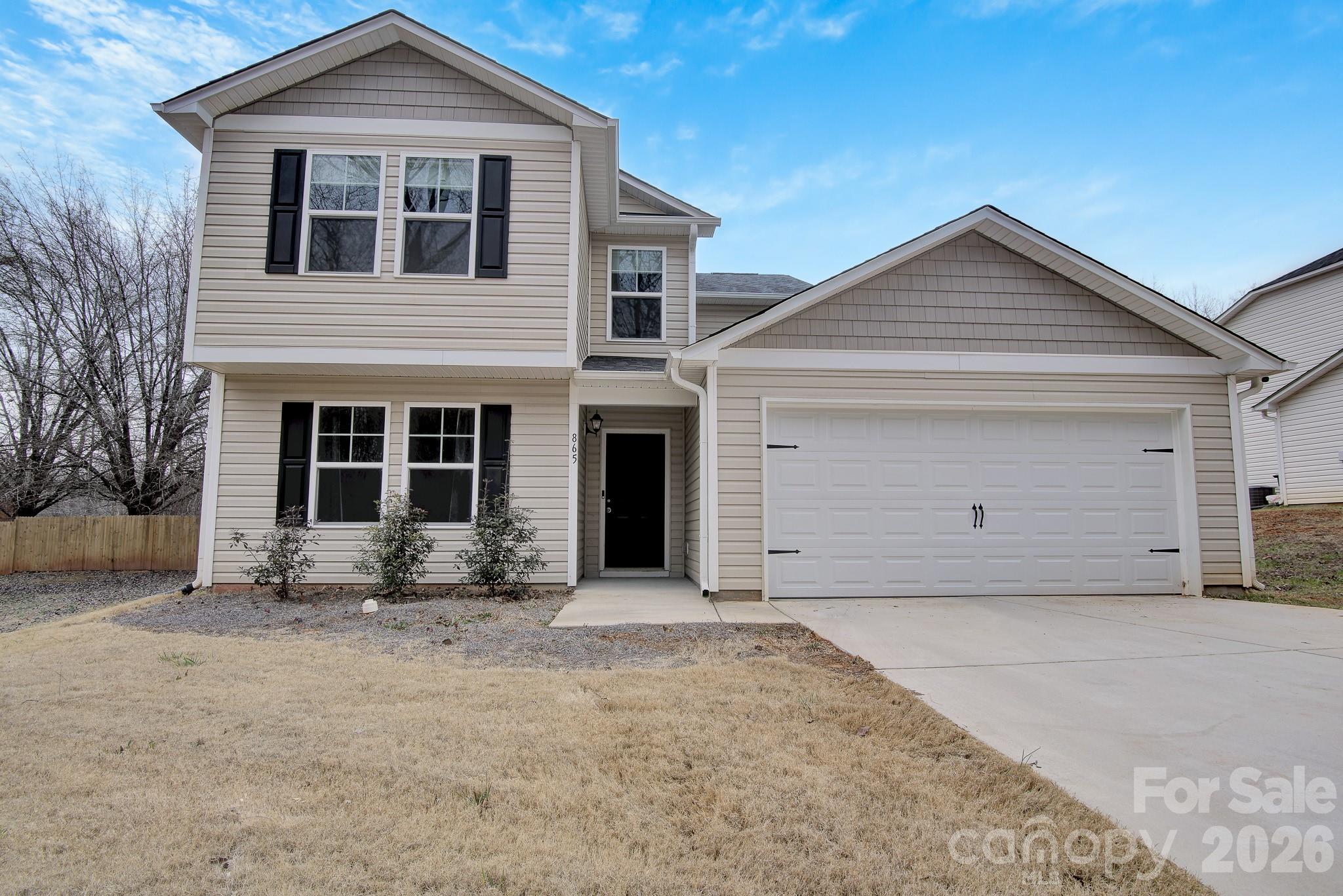 front view of a house with a yard