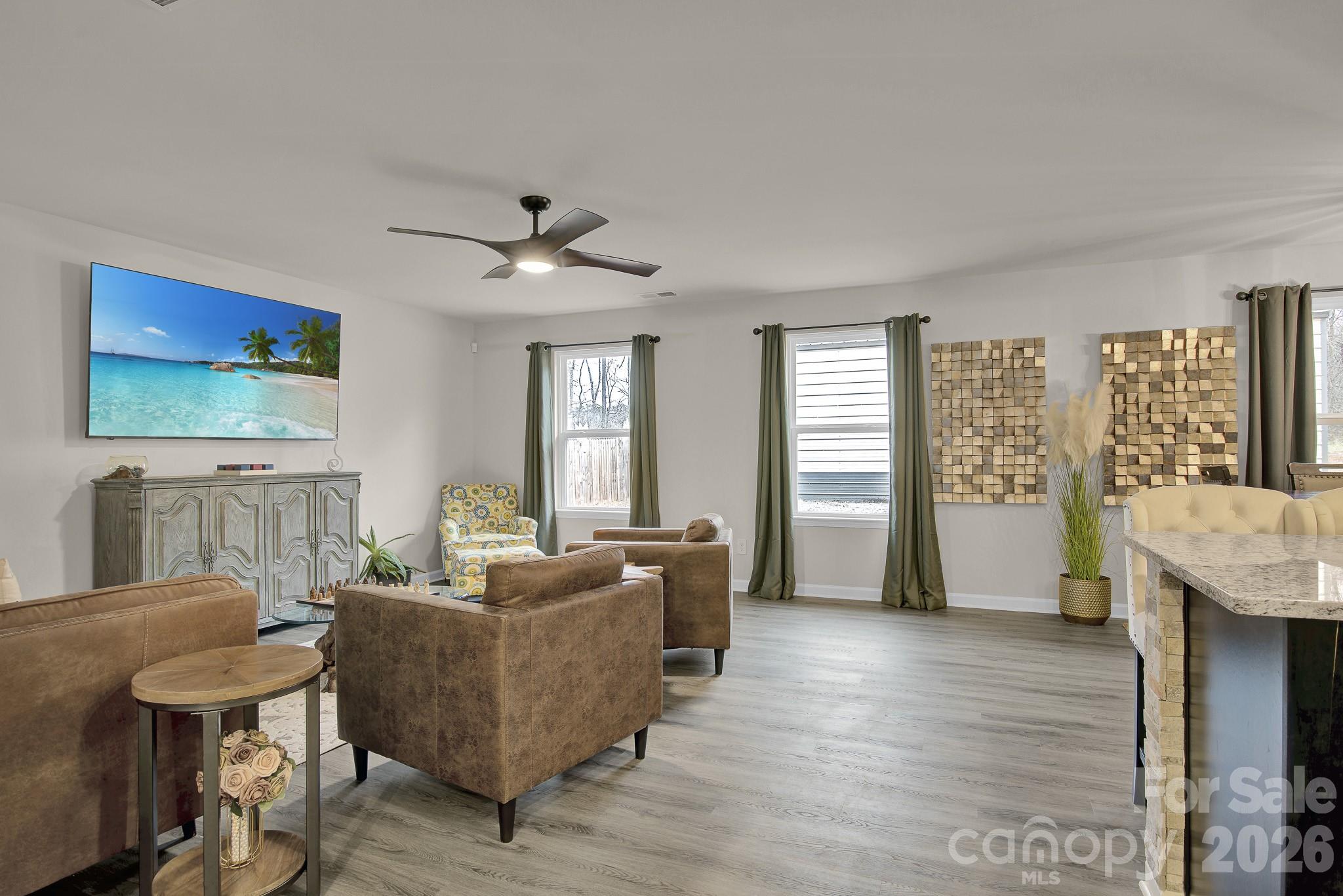 865 Old Linwood Road Lexington, NC 27292 - Photo 16 of 44 a living room with furniture and a flat screen tv