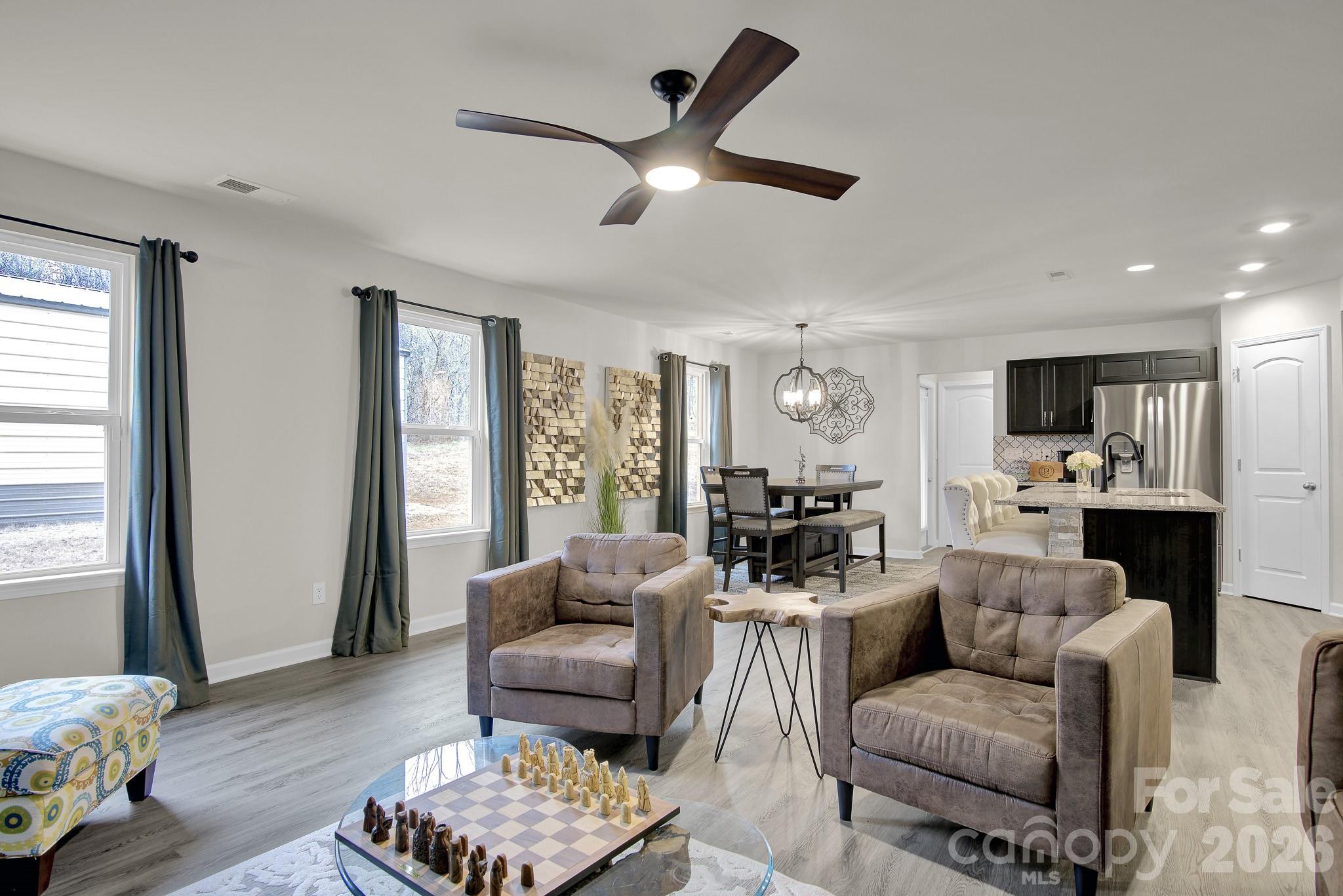 865 Old Linwood Road Lexington, NC 27292 - Photo 18 of 44 a living room with furniture kitchen view and a window