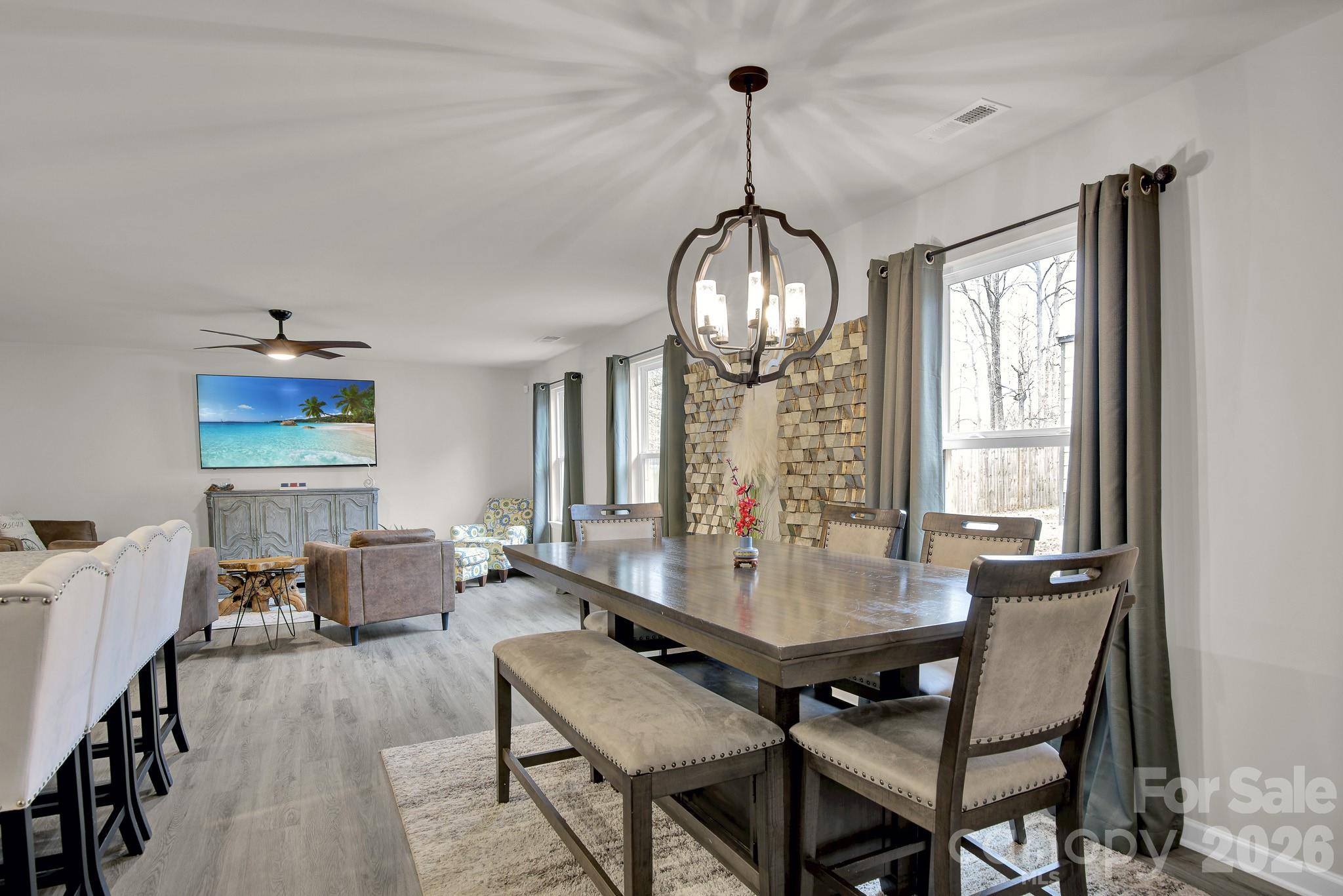 865 Old Linwood Road Lexington, NC 27292 - Photo 22 of 44 a view of a dining room with furniture window and wooden floor