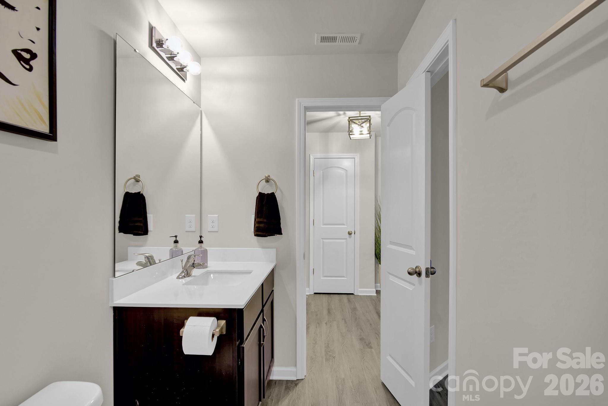 865 Old Linwood Road Lexington, NC 27292 - Photo 27 of 44 a en suite bathroom with a sink and a mirror