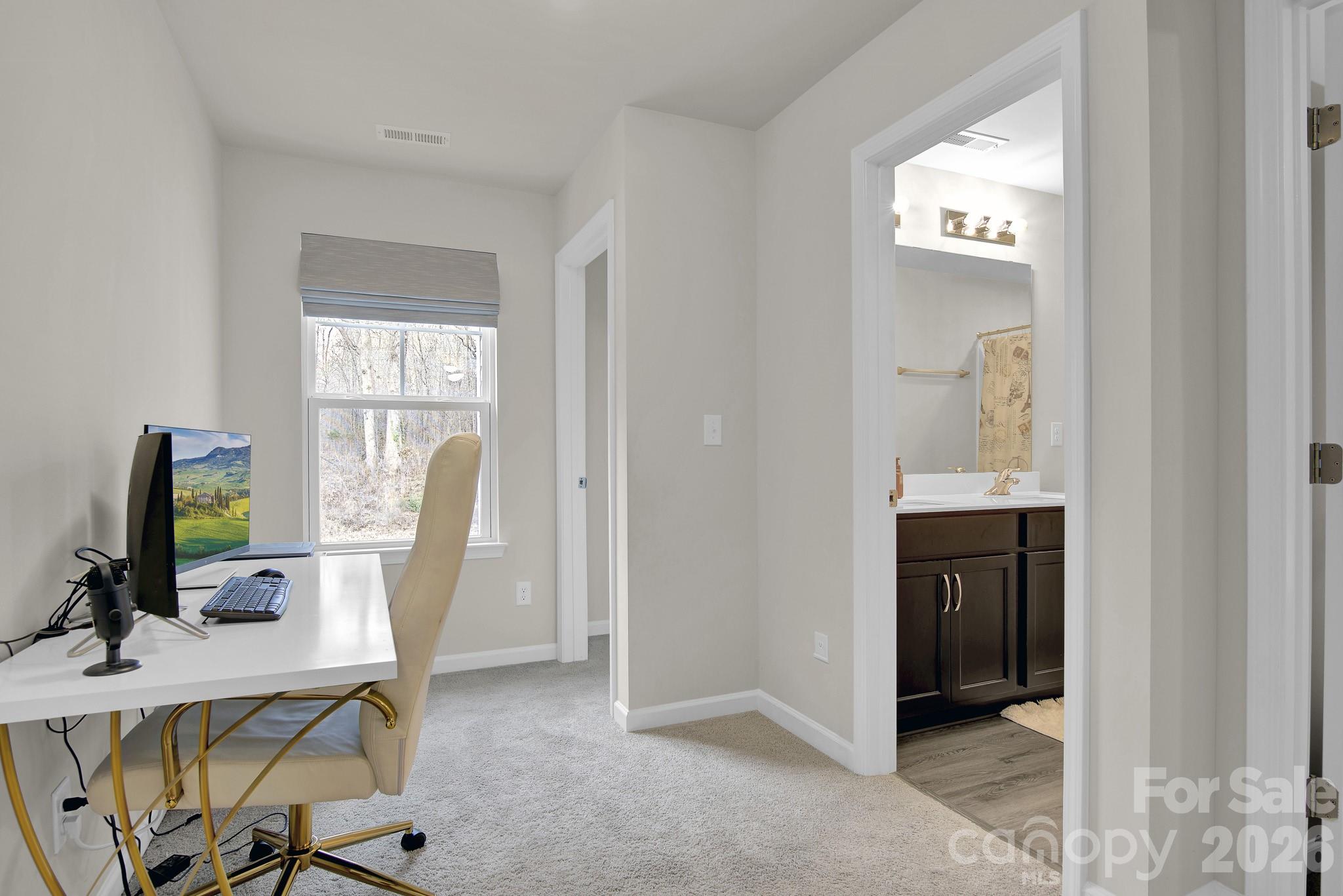 865 Old Linwood Road Lexington, NC 27292 - Photo 35 of 44 a view of a workspace with furniture and a window