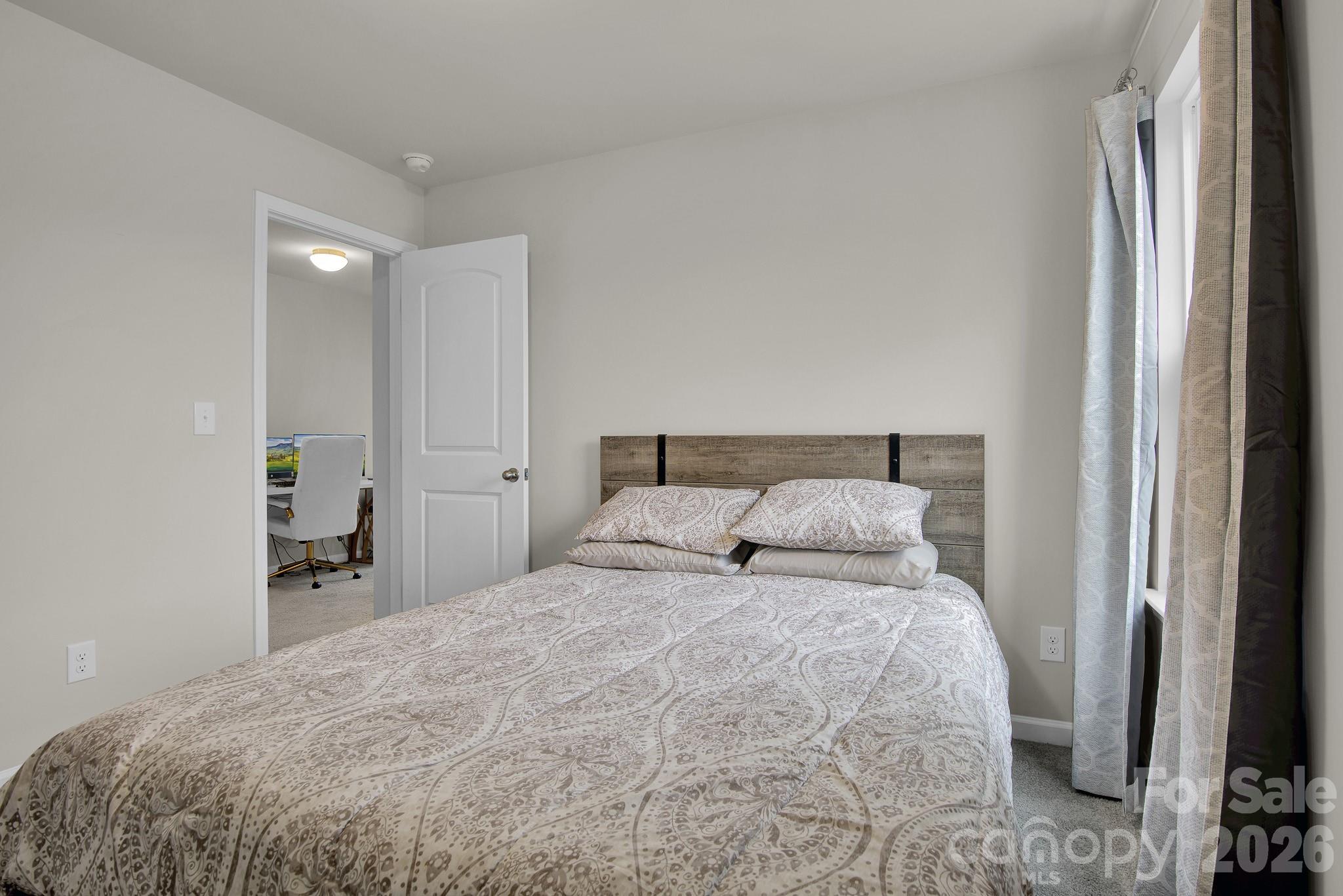 865 Old Linwood Road Lexington, NC 27292 - Photo 38 of 44 a bedroom with a bed and a mirror