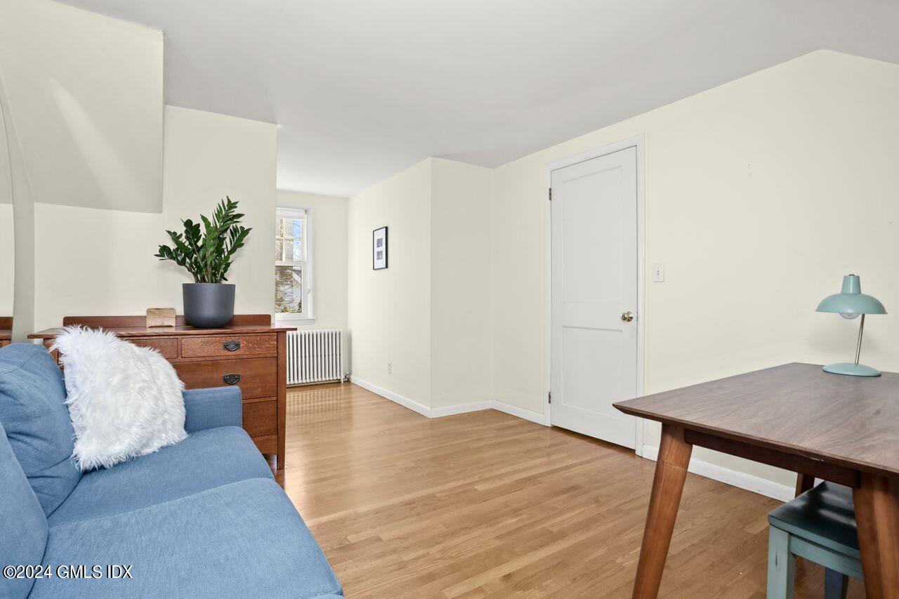 17 Center Road Old Greenwich, CT 06870 - Photo 14 of 30 a workspace room with wooden floor and a table chair