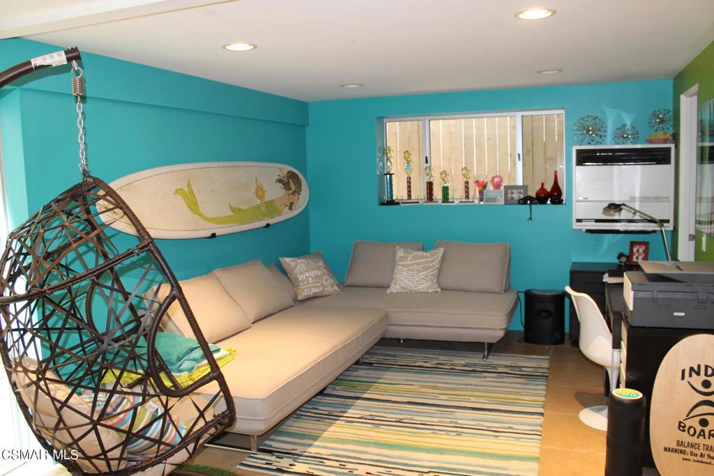 369 Cahuenga Drive Oxnard, CA 93035 - Photo 23 of 36 a living room with a couch and a fireplace