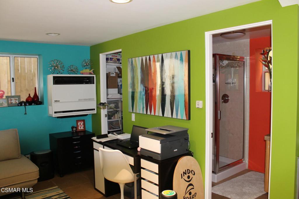 369 Cahuenga Drive Oxnard, CA 93035 - Photo 24 of 36 a living room with furniture a flat screen tv and a window