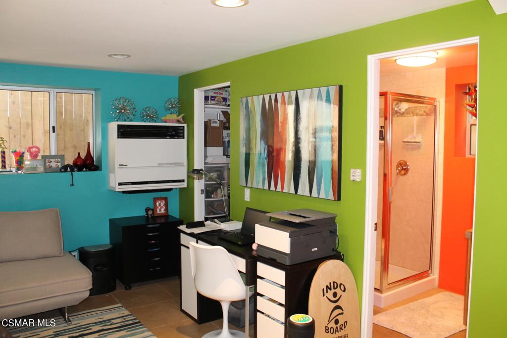 369 Cahuenga Drive Oxnard, CA 93035 - Photo 26 of 36 a living room with furniture a fireplace and a flat screen tv