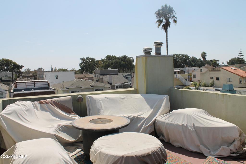 369 Cahuenga Drive Oxnard, CA 93035 - Photo 29 of 36 a picture of table and chairs in a balcony