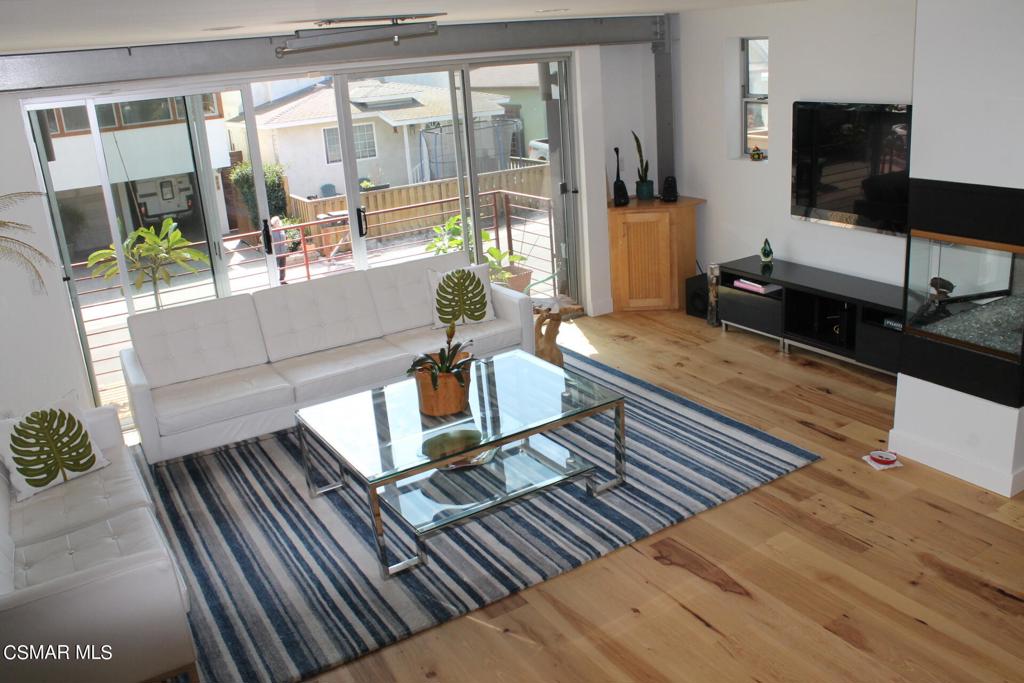 369 Cahuenga Drive Oxnard, CA 93035 - Photo 6 of 36 a living room with furniture and a flat screen tv