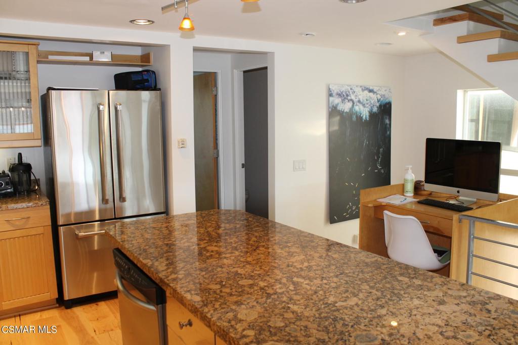 369 Cahuenga Drive Oxnard, CA 93035 - Photo 9 of 36 a kitchen with stainless steel appliances granite countertop a refrigerator and a stove top oven