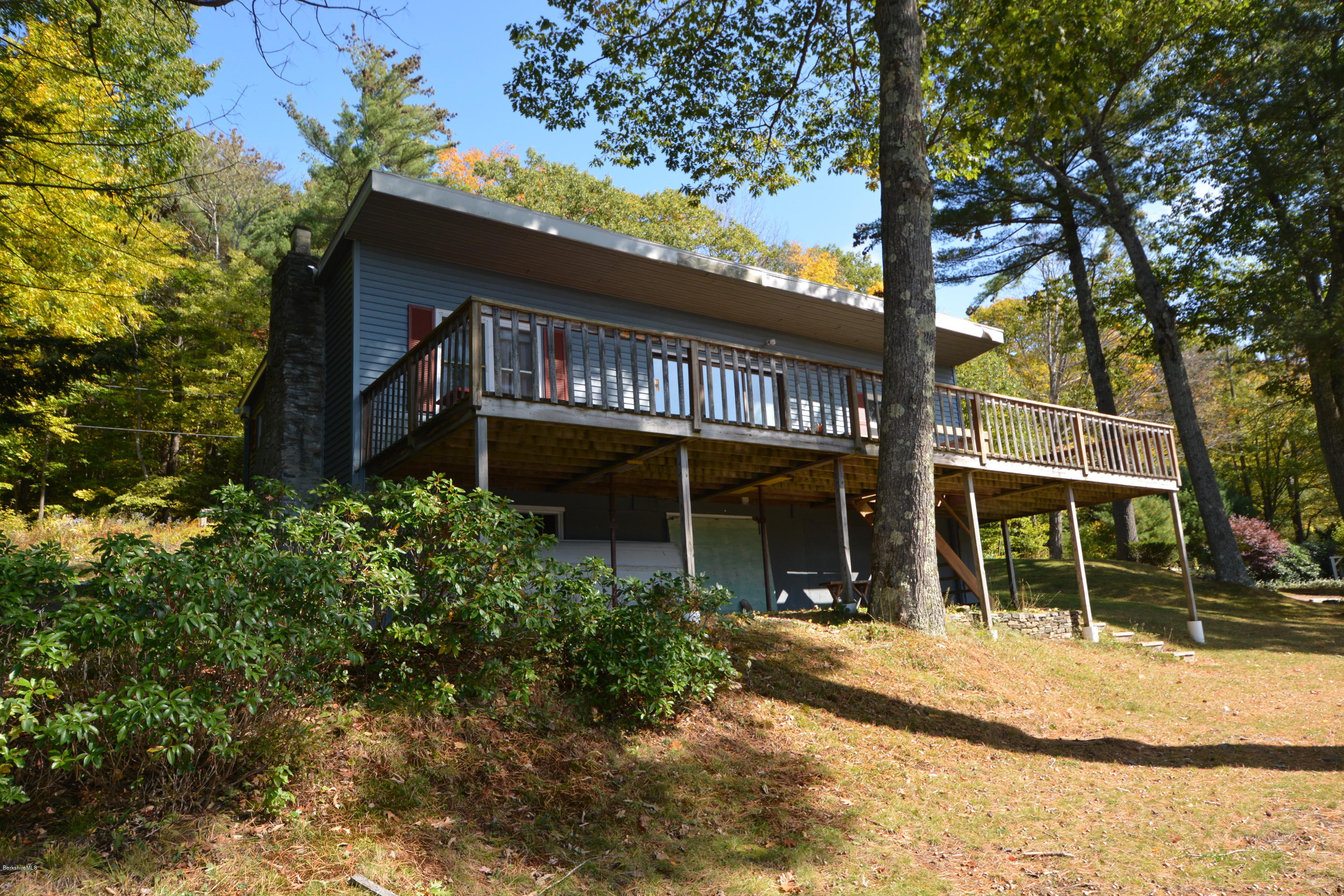 74 Kibbe Road Otis, MA 01029 - Photo 2 of 5 a front view of a house with a yard
