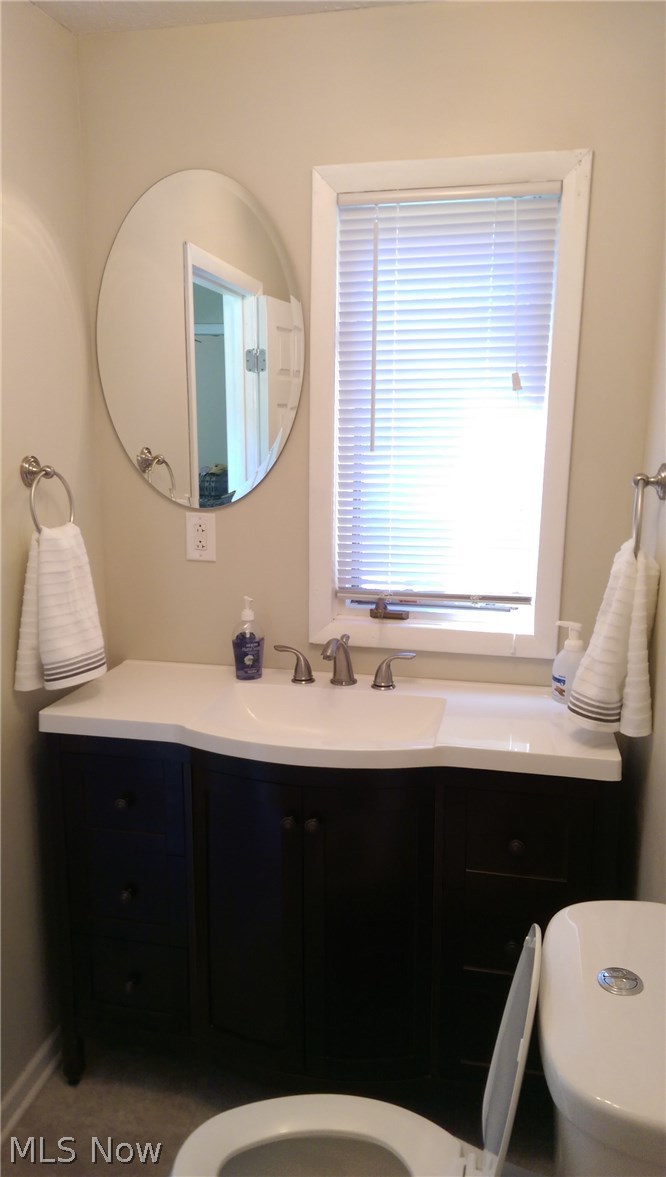 4620 Fenn Road Medina, OH 44256 - Photo 8 of 20 First Floor half bath with new vanity, fixtures, flooring and water-saving features