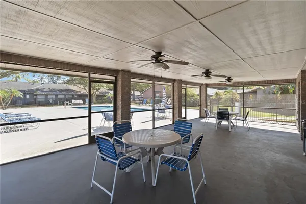 a dining room with furniture and window