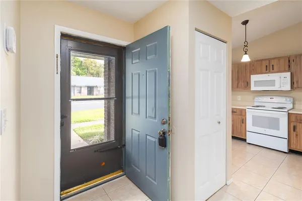 a view of a kitchen with a sink dishwasher and wooden floor