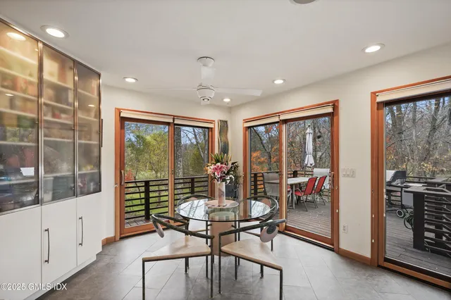 a kitchen with stainless steel appliances granite countertop a sink and a refrigerator