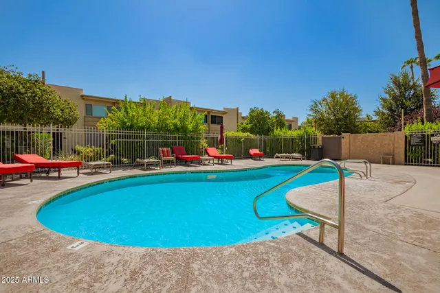 a view of a swimming pool with a patio