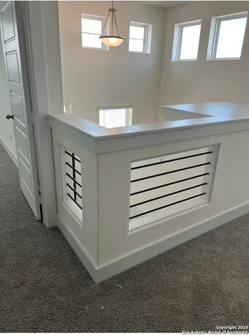 a view of a livingroom with entryway and window