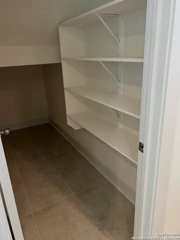 a view of an empty walk in closet