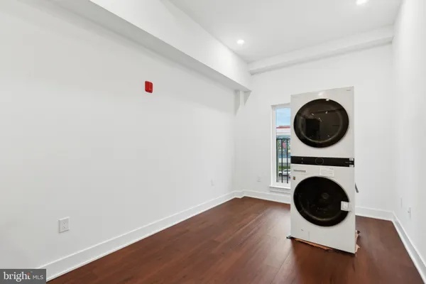 a view of livingroom with washer and dryer