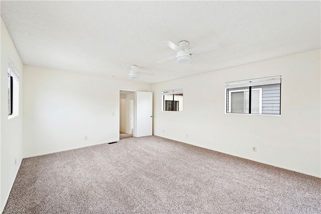 a view of a balcony with a large tree