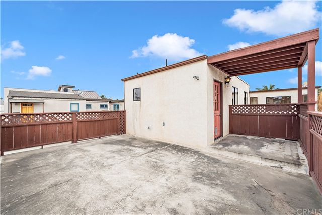 a bathroom with a granite countertop sink a mirror and a shower
