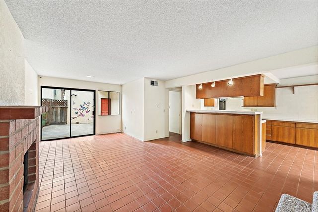 a view of a kitchen with a sink and an oven