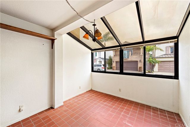 a view of kitchen with furniture and refrigerator