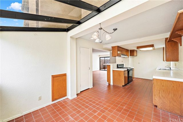 a kitchen with stainless steel appliances granite countertop a stove and a sink