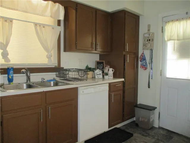 a bathroom with a sink and a window