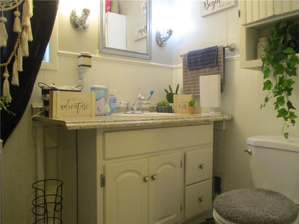 127 Cherry Way Donora, PA 15033 - Photo 23 of 33 a bathroom with a sink a toilet and mirror