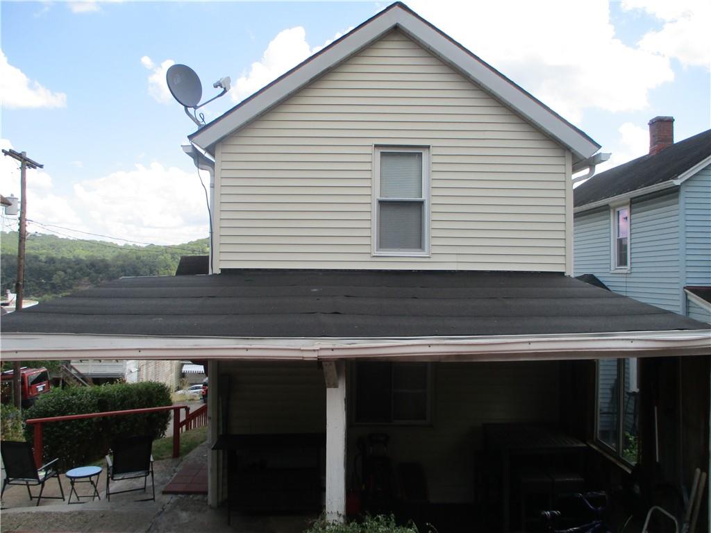 127 Cherry Way Donora, PA 15033 - Photo 4 of 33 a view of a roof deck with table and chairs a barbeque with wooden floor and fence