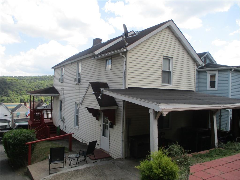 127 Cherry Way Donora, PA 15033 - Photo 6 of 33 a view of house with backyard outdoor seating and hardwood
