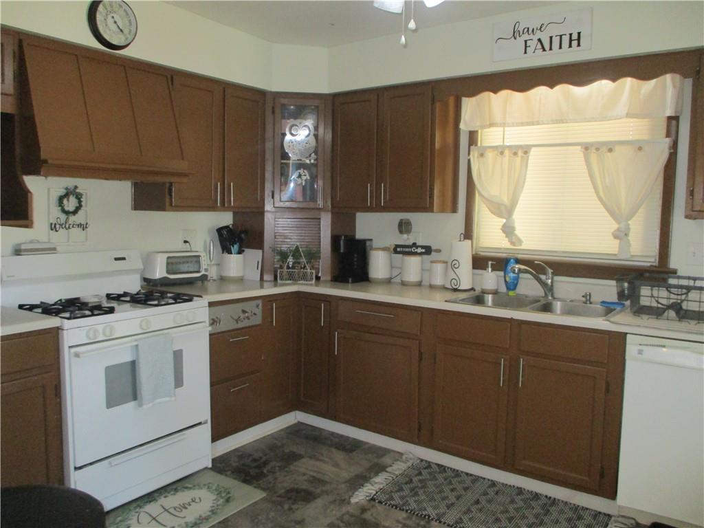 127 Cherry Way Donora, PA 15033 - Photo 10 of 33 a kitchen with a sink stove and cabinets