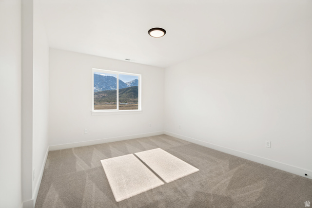 1351 Maple Circle Santaquin, UT 84655 - Photo 24 of 42 Bright room with neutral carpeting, white walls, and a single window