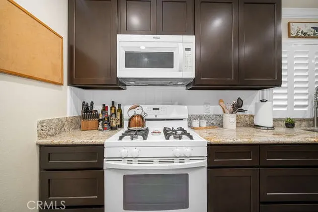 a kitchen with a stove and a sink