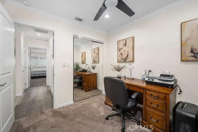 a view of a workspace with furniture and a workspace