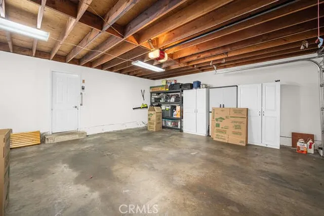 a view of empty room with wooden ceiling